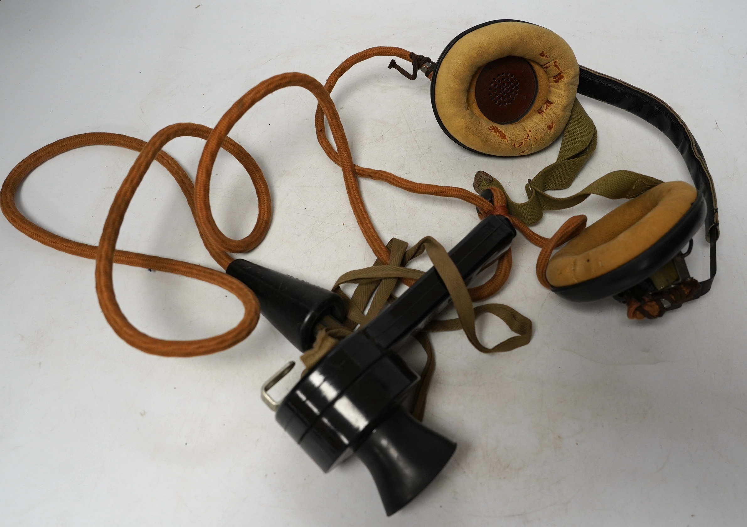 A collection of various WWII military and RAF related items including; an aviation headset, microphone, compass, odometer, morse code tapper, RAF cap, etc. Condition - poor to fair